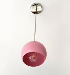 Chrome and Pink globe shape pendant light inspired by midcentury modern design
