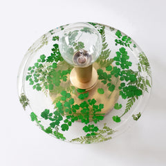 handmade flora wall sconce or flush mount ceiling light with shades of green, brass, and clear resin. view from below