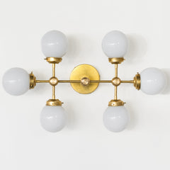 Brass and Glass large bathroom wall sconce with six globes.  Great for large bathroom spaces or used as a ceiling flushmount ceiling light fixture