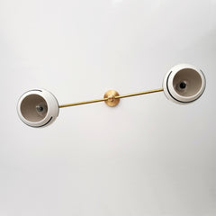 black and white boho chandelier with brass accents and porcelain shades
