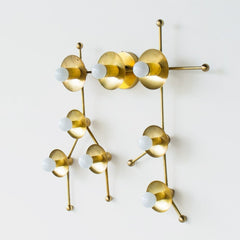 Brass sconce or flush mount ceiling light in the shape of  the Gemini constellation.  Astrology inspired light fixture - side view of the brass version