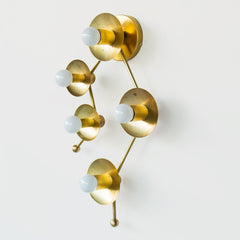 Brass sconce or flush mount ceiling light in the shape of  the Gemini constellation.  Astrology inspired light fixture