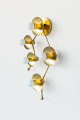 Brass sconce or flush mount ceiling light in the shape of  the Gemini constellation.  Astrology inspired light fixture side view