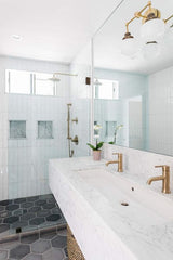 McMain wall sconce in modern bathroom renovation