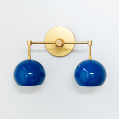Blue and brass mid century modern two light wall sconce
