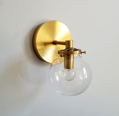 modern brass wall sconce with clear shade bathroom lighting globe