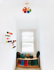 Rainbow ceiling light in a midcentury modern mud room