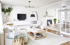 California white open-concept living room with light wood coffee table and end tables.  Modern interior design in cali-style.