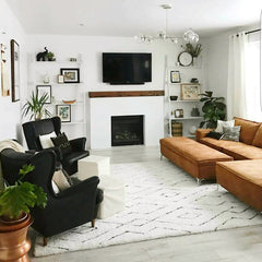 chrome Carousel Chandelier in a neutral living room design with leather sofas