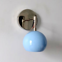 Light blue and chrome mid century modern wall sconce light fixture by Sazerac Stitches and made in New Orleans side view