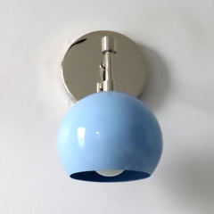 Light blue and chrome mid century modern wall sconce light fixture by Sazerac Stitches and made in New Orleans bottom view