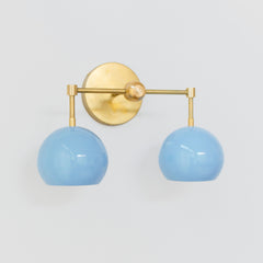 Brass and pastel blue two light mid century modern wall sconce for bathroom renovations