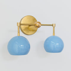 Brass and pastel blue two light mid century modern wall sconce for bathroom renovations