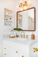 six light brass wall sconce with white globes.  Glamorous modern wall sconce by sazerac stitches
