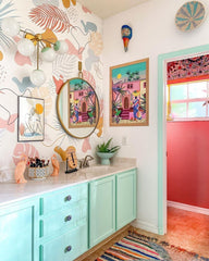 Charity sconce on boho pastel wallpaper with a mint vanity