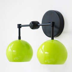 Brass and matte black two light wall sconce