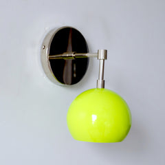 chartreuse green and chrome wall sconce inspired by mid century modern design