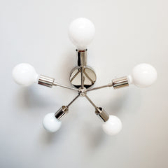 Chrome five light sconce or flushmount ceiling fixture with mid century modern design