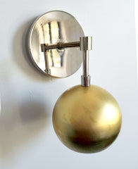 modern brass and chrome eyeball wall sconce