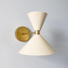 Cream and brass midcentury modern inspired cone wall sconce