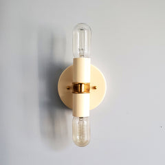 cream  and Brass two light wall sconce or flush mount ceiling light fixture in a bright vibrant color and mid century modern or art deco design