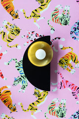 This Kin Sconce in black and brass pairs classic materials with contemporary form. A matte black half-circle anchors the piece, while a round brass reflector bounces warm, ambient light forward. Whether used in a vintage-modern bathroom, a layered gallery wall moment, or to accentuate architectural features, it offers a timeless balance of contrast and shine. A go-to for fans of deco revival, minimalist luxe, or rich, tailored interiors with a touch of mid-century inspiration.
