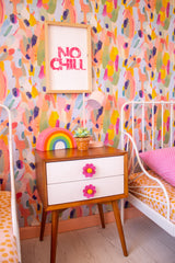 Doll Pink Daisy Drawer pulls on a nightstand in a colorful retro bedroom