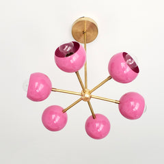 Pink and Brass mid century modern chandelier with globe shades
