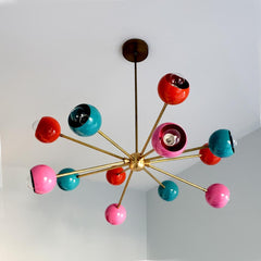 multicolored mid century modern sputnik style chandelier with pink orange and teal