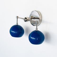 Chrome and blue mid century modern inspired bathroom wall sconce with two sockets