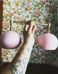 Pink and Brass two light wall sconce with flower vintage style wallpaper