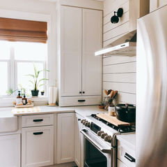 Farmhouse modern kitchen with black mid century modern wall sconces