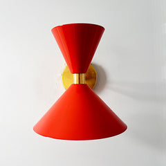 poppy red and brass midcentury modern cone shaped wall sconce by sazerac stitches