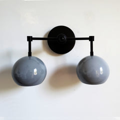 black and grey mid century modern two light bathroom wall sconce