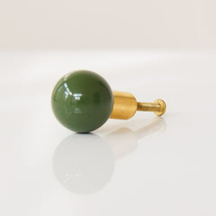 Olive and Brass kid furniture drawer cabinet pull in olive green with brass accents.  Made by Sazerac Stitches