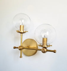 brass and clear glass globe L shaped wall sconce modernist midcentury modern contemporary wall lighting