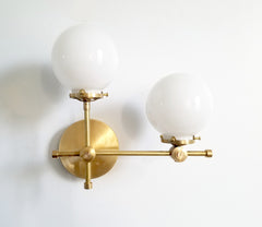 brass gold and white glass globe L shaped wall sconce modernist midcentury modern contemporary wall lighting