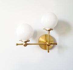 brass gold and white glass globe L shaped wall sconce modernist midcentury modern contemporary wall lighting