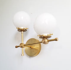 brass gold and white glass globe L shaped wall sconce modernist midcentury modern contemporary wall lighting