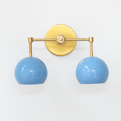 Pastel blue and brass mid century modern two light bathroom sconce