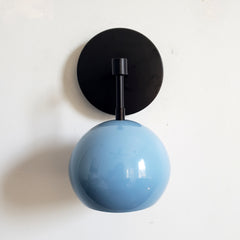 Black and Hydrangea Blue midcentury inspired eyeball shade wall sconce by Sazerac Stitches