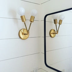 Felicity wall sconce in a bathroom remodel with shiplap walls and modern black square mirror - felicity sconce by sazerac stitches