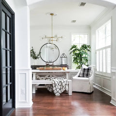 farmhouse modern dining room table with benches and a modern glass chandelier by Sazerac Stitches