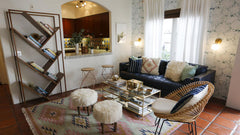 Jones sconces by Sazerac Stitches next to a sofa