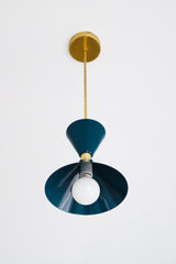 dark teal and brass mid century modern inspired pendant light fixture for kitchen island design