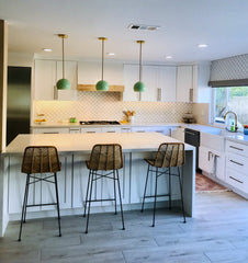 Large Loa Pendants in Mint by Sazerac Stitches above a waterfall edge kitchen island