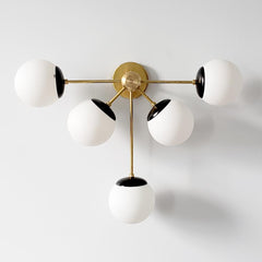 Brass and Matte Black Art Deco inspired oversized modern wall sconce