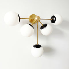 Brass and Matte Black Art Deco inspired oversized modern wall sconce