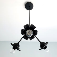 Side view of black floral chandelier by Sazerac Stitches