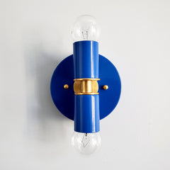 Bright blue and Brass two light wall sconce or flush mount ceiling light fixture in a bright vibrant color and mid century modern or art deco design